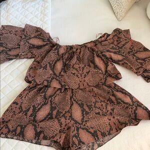 Olivaceous Animal Print Romper with shorts and pockets.